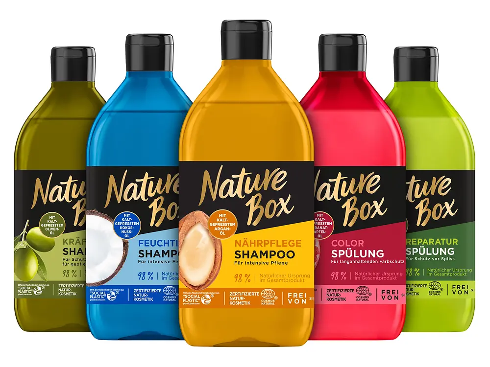 Five colorful bottles of Nature Box lined up next to each other.